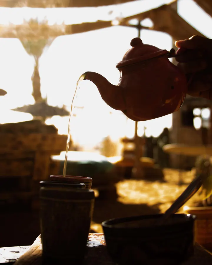 Mint tea poured from a teapot in a cafe in Morocco